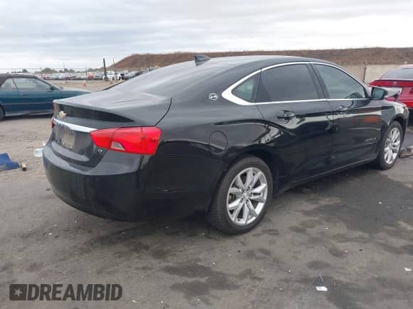2018 Chevrolet Impala LT with VIN 1G1105SA7JU138922, listed as a IAAI auction lot 43323071 with 149,546 mi miles and . Bid and sale history available at DreamBid. Image 4.