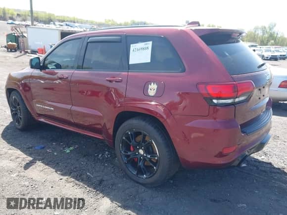 2016 Jeep Grand Cherokee SRT z VIN 1C4RJFDJ0GC366138, wystawiony jako IAAI lot #42169808 z przebiegiem 103 270 mil mil oraz . Historia ofert i sprzedaży dostępna na DreamBid. Obrazek 3.
