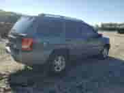 2002 Jeep Grand Cherokee Laredo with VIN 1J4GW48S42C251464, listed as a Copart auction lot 71964815 with 144,429 mi miles and Salvage title. Bid and sale history available at DreamBid. Image 3.