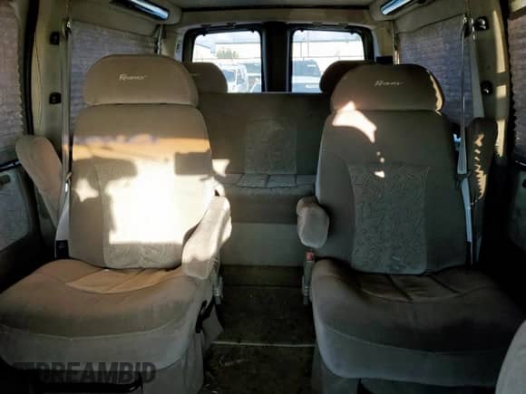 2004 Chevrolet Express Passenger z VIN 1GBFG15T541155274, wystawiony jako Copart lot #82241335 z przebiegiem 103 028 mil mil oraz Szkoda całkowita • Salvage title. Historia ofert i sprzedaży dostępna na DreamBid. Obrazek 10.