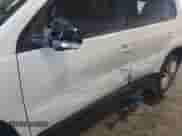 2013 Volkswagen Tiguan with VIN WVGCV3AX7DW605594, listed as a IAAI auction lot 42057457 with 131,629 mi miles and . Bid and sale history available at DreamBid. Image 6.