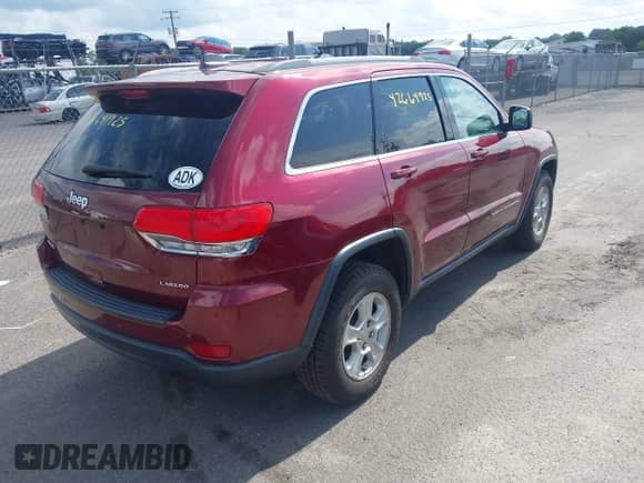2017 Jeep Grand Cherokee Laredo with VIN 1C4RJFAG3HC958840, listed as a IAAI auction lot 42664925 with 111,896 mi miles and . Bid and sale history available at DreamBid. Image 4.