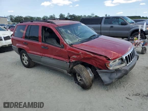 2002 Jeep Grand Cherokee Sport with VIN 1J4GW38S72C252344, listed as a Copart auction lot 61769485 with 306,152 mi miles and Salvage title. Bid and sale history available at DreamBid. Image 4.