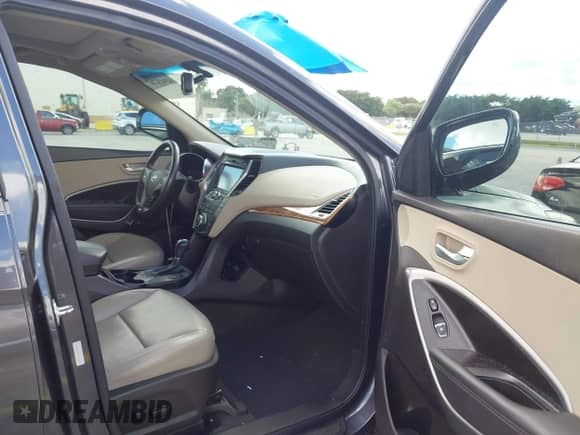 2016 Hyundai Santa Fe with VIN 5XYZUDLB6GG337079, listed as a IAAI auction lot 43424247 with Not provided miles and . Bid and sale history available at DreamBid. Image 5.