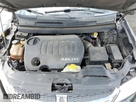 2012 Dodge Journey SXT z VIN 3C4PDCBG4CT135004, wystawiony jako Copart lot #68670485 z przebiegiem 202 652 mil mil oraz Szkoda całkowita • Salvage title. Historia ofert i sprzedaży dostępna na DreamBid. Obrazek 12.
