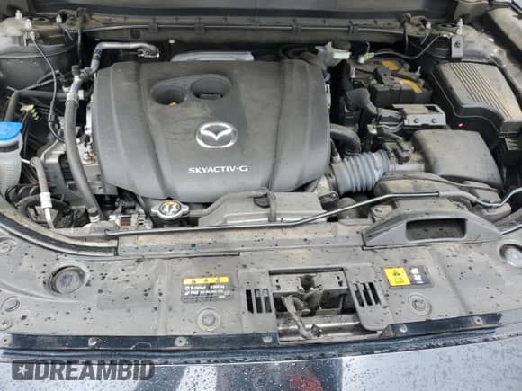 2022 Mazda CX-5 S Carbon Edition z VIN JM3KFBCM0N1582885, wystawiony jako Copart lot #68640085 z przebiegiem 62 164 mil mil oraz Szkoda całkowita • Salvage title. Historia ofert i sprzedaży dostępna na DreamBid. Obrazek 11.