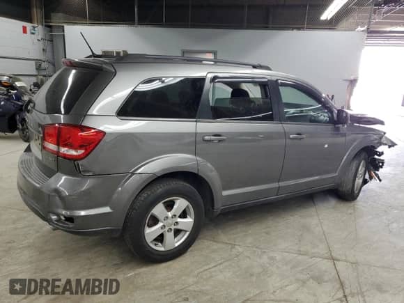 2012 Dodge Journey SXT z VIN 3C4PDDBG5CT397376, wystawiony jako Copart lot #60910235 z przebiegiem 171 677 mil mil oraz Szkoda całkowita • Salvage title. Historia ofert i sprzedaży dostępna na DreamBid. Obrazek 3.