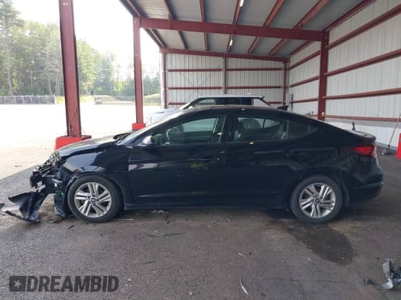 2019 Hyundai Elantra SEL z VIN 5NPD84LF1KH410376, wystawiony jako IAAI lot #42586075 z przebiegiem 119 711 mil mil oraz . Historia ofert i sprzedaży dostępna na DreamBid. Obrazek 14.