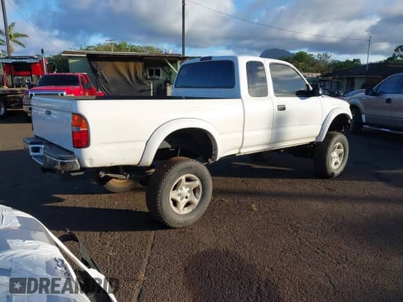 2002 Toyota Tacoma z VIN 5TEWN72N92Z065123, wystawiony jako IAAI lot #42571727 z przebiegiem 206 384 mil mil oraz . Historia ofert i sprzedaży dostępna na DreamBid. Obrazek 4.