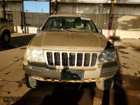 2000 Jeep Grand Cherokee Limited z VIN 1J4GW58N0YC419352, wystawiony jako Copart lot #86405605 z przebiegiem 211 579 mil mil oraz Czysty tytuł • Clean title. Historia ofert i sprzedaży dostępna na DreamBid. Obrazek 5.