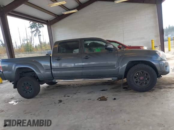 2014 Toyota Tacoma PreRunner with VIN 3TMKU4HN9EM042319, listed as a IAAI auction lot 43450085 with 89,135 mi miles and . Bid and sale history available at DreamBid. Image 13.