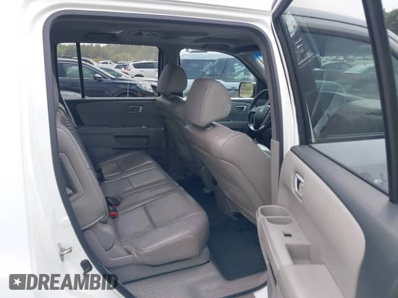 2013 Honda Pilot EX-L with VIN 5FNYF4H63DB077552, listed as a IAAI auction lot 42483801 with 218,823 mi miles and . Bid and sale history available at DreamBid. Image 8.