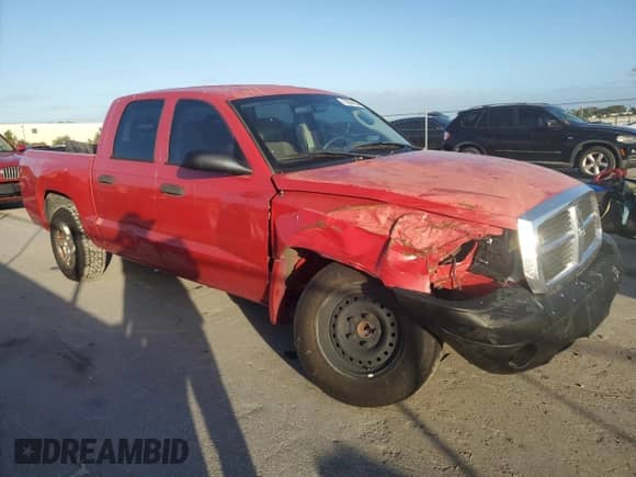 2006 Dodge Dakota z VIN 1D5HE48NX6S503428, wystawiony jako Copart lot #79024054 z przebiegiem 152 956 mil mil oraz Szkoda całkowita • Salvage title. Historia ofert i sprzedaży dostępna na DreamBid. Obrazek 4.