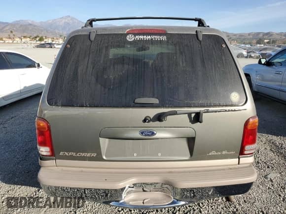 2000 Ford Explorer Eddie Bauer with VIN 1FMDU74E2YZB30465, listed as a Copart auction lot 87244384 with 166,225 mi miles and Salvage title. Bid and sale history available at DreamBid. Image 6.