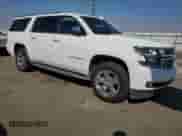 2016 Chevrolet Suburban LTZ with VIN 1GNSCJKC7GR415956, listed as a Copart auction lot 71857055 with 213,861 mi miles and Salvage title. Bid and sale history available at DreamBid. Image 4.