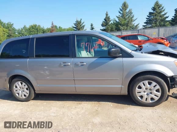 2014 Dodge Grand Caravan SE z VIN 2C4RDGBG6ER362491, wystawiony jako IAAI lot #42977761 z przebiegiem 240 771 mil mil oraz . Historia ofert i sprzedaży dostępna na DreamBid. Obrazek 14.