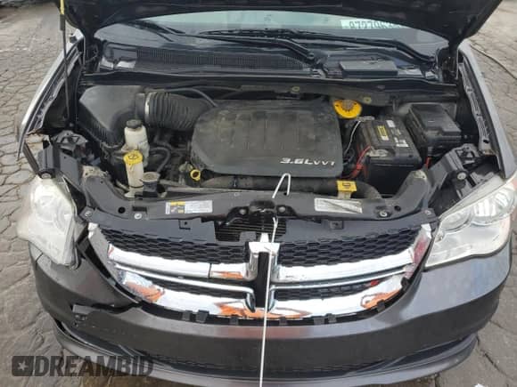 2015 Dodge Grand Caravan SXT z VIN 2C4RDGCG1FR581911, wystawiony jako Copart lot #87279635 z przebiegiem 136 076 mil mil oraz Szkoda całkowita • Salvage title. Historia ofert i sprzedaży dostępna na DreamBid. Obrazek 12.