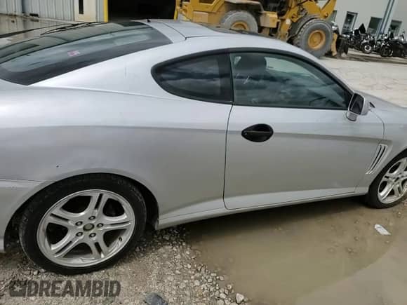 2004 Hyundai Tiburon GT с VIN KMHHN65F54U112744, выставлен на аукционе Copart как лот 57850495 с пробегом 103 409 миль миль и Списание • Salvage title. История ставок и продаж доступна на DreamBid. Изображение 13.