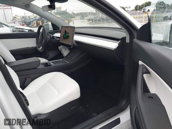 2022 Tesla Model Y Long Range z VIN 7SAYGDEE4NF510003, wystawiony jako IAAI lot #43185983 z przebiegiem 25 165 mil mil oraz . Historia ofert i sprzedaży dostępna na DreamBid. Obrazek 5.