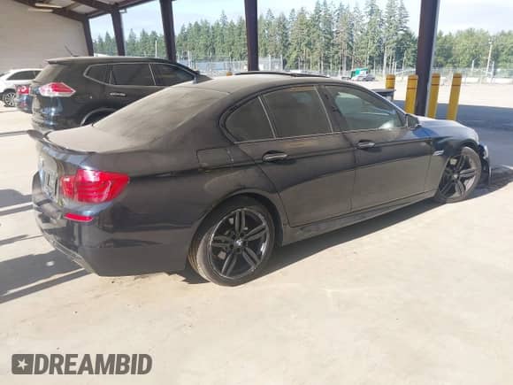 2014 BMW 5 Series 535d with VIN WBAXA5C50ED001937, listed as a IAAI auction lot 42750664 with 99,827 mi miles and . Bid and sale history available at DreamBid. Image 4.