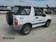 2001 Chevrolet Tracker с VIN 2CNBJ18C216900249, выставлен на аукционе Copart как лот 77476204 с пробегом Не указан миль и Списание • Salvage title. История ставок и продаж доступна на DreamBid. Изображение 3.
