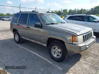 1998 Jeep Grand Cherokee Laredo with VIN 1J4GZ48S8WC349667, listed as a IAAI auction lot 43325604 with 232,752 mi miles and . Bid and sale history available at DreamBid. Image 1.