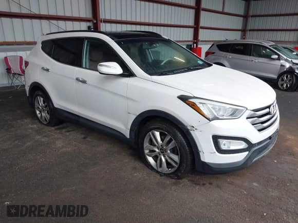 2015 Hyundai Santa Fe with VIN 5XYZWDLA2FG257231, listed as a IAAI auction lot 41868240 with 218,321 mi miles and . Bid and sale history available at DreamBid. Image 1.
