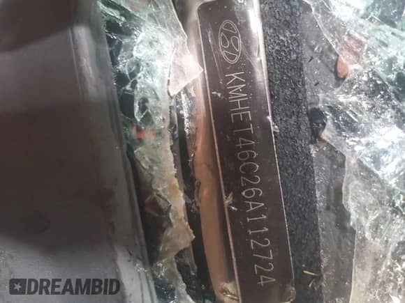 2006 Hyundai Sonata GL z VIN KMHET46C26A112724, wystawiony jako Copart lot #60867705 z przebiegiem Nie podano mil oraz Szkoda całkowita • Salvage title. Historia ofert i sprzedaży dostępna na DreamBid. Obrazek 12.