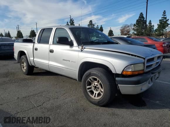 2002 Dodge Dakota Sport z VIN 1B7HL38N72S525267, wystawiony jako Copart lot #43266835 z przebiegiem 249 502 mil mil oraz Szkoda całkowita • Salvage title. Historia ofert i sprzedaży dostępna na DreamBid. Obrazek 4.