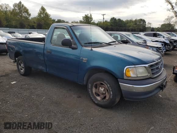2001 Ford F-150 XL with VIN 1FTRF17W71NA44992, listed as a Copart auction lot 81205035 with 125,671 mi miles and Salvage title. Bid and sale history available at DreamBid. Image 4.