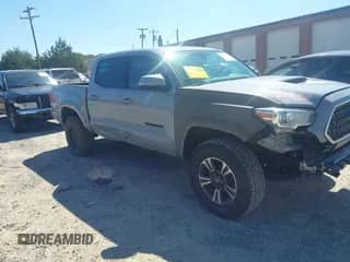 2019 Toyota Tacoma TRD Off Road z VIN 3TMCZ5AN2KM207371, wystawiony jako IAAI lot #43130878 z przebiegiem 104 178 mil mil oraz . Historia ofert i sprzedaży dostępna na DreamBid. Obrazek 1.