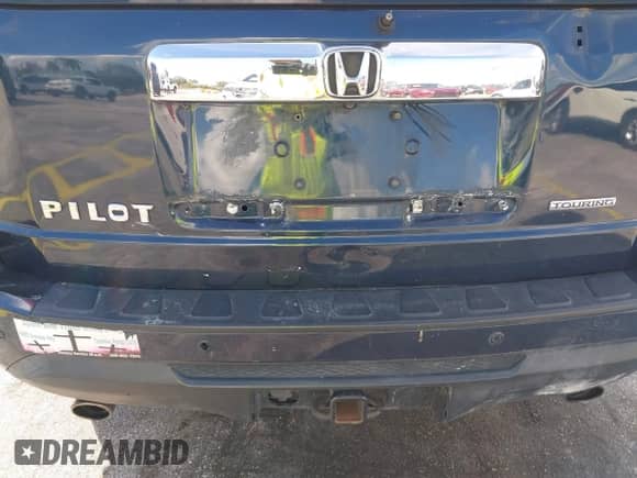 2012 Honda Pilot Touring with VIN 5FNYF3H95CB039789, listed as a IAAI auction lot 43555620 with 261,011 mi miles and . Bid and sale history available at DreamBid. Image 18.