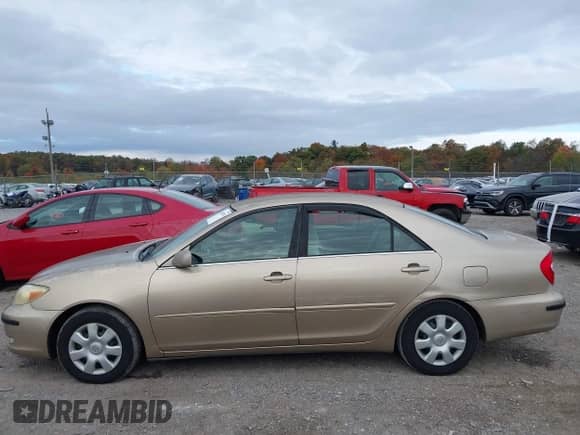 2002 Toyota Camry LE with VIN 4T1BE32K92U069870, listed as a IAAI auction lot 43498390 with 137,376 mi miles and . Bid and sale history available at DreamBid. Image 6.