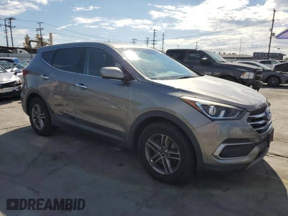 2018 Hyundai Santa Fe 2.4L с VIN 5NMZT3LB1JH089446, выставлен на аукционе Copart как лот 87306895 с пробегом 95 904 миль миль и Списание • Salvage title. История ставок и продаж доступна на DreamBid. Изображение 4.