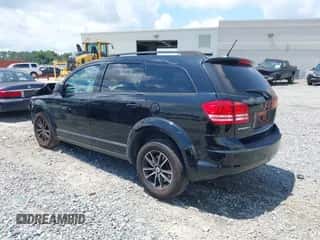 2018 Dodge Journey SE with VIN 3C4PDCAB0JT157987, listed as a IAAI auction lot 42995989 with 128,143 mi miles and . Bid and sale history available at DreamBid. Image 3.