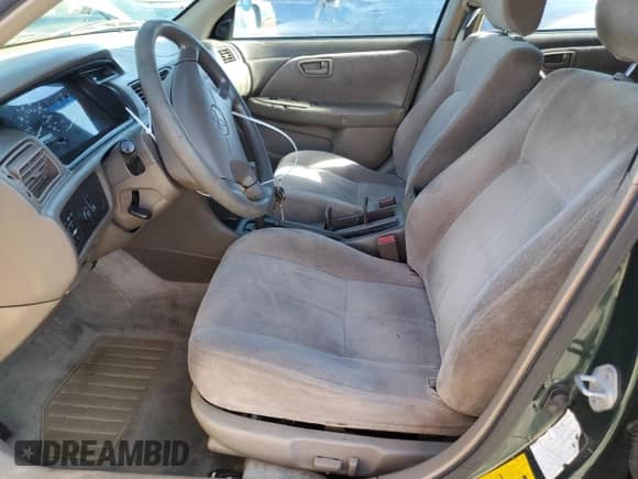 1999 Toyota Camry LE z VIN JT2BG28KXX0359137, wystawiony jako Copart lot #85011045 z przebiegiem 158 951 mil mil oraz Czysty tytuł • Clean title. Historia ofert i sprzedaży dostępna na DreamBid. Obrazek 7.