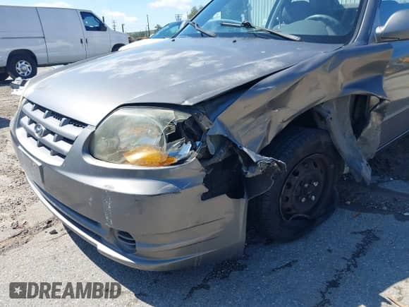 2005 Hyundai Accent GLS z VIN KMHCG35C25U348410, wystawiony jako IAAI lot #41729780 z przebiegiem 166 216 mil mil oraz . Historia ofert i sprzedaży dostępna na DreamBid. Obrazek 12.