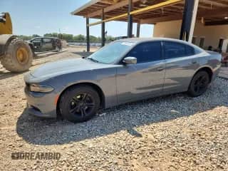 2019 Dodge Charger SXT with VIN 2C3CDXBG6KH664794, listed as a Copart auction lot 71906185 with 69,204 mi miles and Salvage title. Bid and sale history available at DreamBid. Image 1.