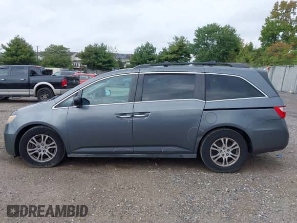 2012 Honda Odyssey EX z VIN 5FNRL5H40CB083650, wystawiony jako IAAI lot #43283741 z przebiegiem 164 693 mil mil oraz . Historia ofert i sprzedaży dostępna na DreamBid. Obrazek 14.