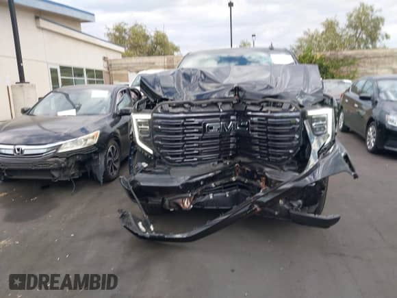2024 GMC Sierra 1500 Denali Ultimate with VIN 1GTUUHEL6RZ384138, listed as a IAAI auction lot 43111543 with 27,138 mi miles and . Bid and sale history available at DreamBid. Image 6.