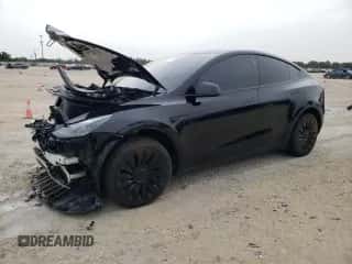 2024 Tesla Model Y Long Range with VIN 7SAYGDEEXRA273732, listed as a Copart auction lot 62633134 with 1,936 mi miles and Salvage title. Bid and sale history available at DreamBid. Image 1.