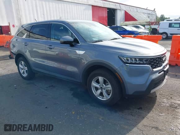 2023 Kia Sorento LX with VIN 5XYRGDLC7PG168609, listed as a IAAI auction lot 42893738 with 32,559 mi miles and . Bid and sale history available at DreamBid. Image 1.