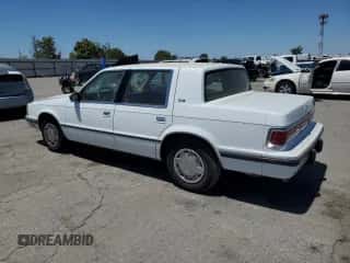 1989 Dodge Dynasty с VIN 1B3BC463XKD594439, выставлен на аукционе Copart как лот 65792195 с пробегом 61 970 миль миль и Чистый • Clean title. История ставок и продаж доступна на DreamBid. Изображение 2.
