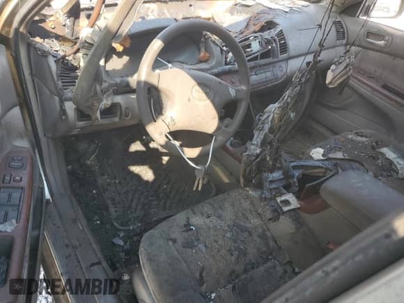 2003 Toyota Camry XLE с VIN 4T1BE30K73U683658, выставлен на аукционе Copart как лот 81338465 с пробегом Не указан миль и Списание • Salvage title. История ставок и продаж доступна на DreamBid. Изображение 8.