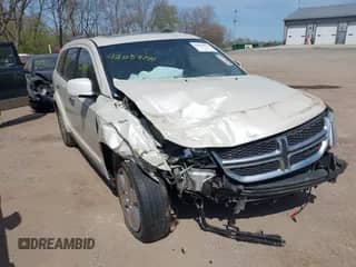 2013 Dodge Journey Crew with VIN 3C4PDDDGXDT590038, listed as a IAAI auction lot 42059171 with 185,632 mi miles and . Bid and sale history available at DreamBid. Image 1.