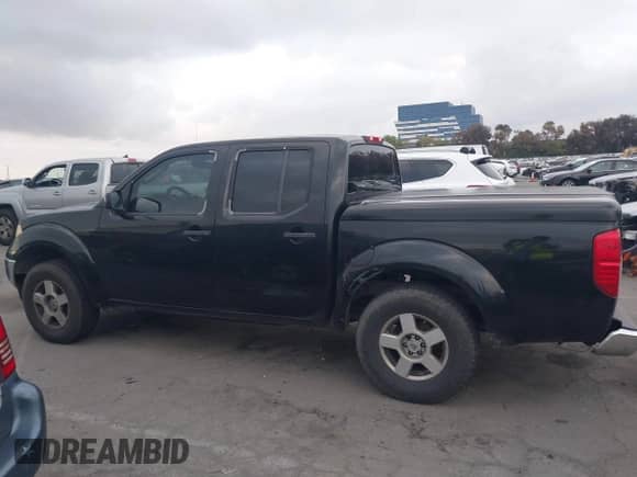 2006 Nissan Frontier LE with VIN 1N6AD07U26C440050, listed as a IAAI auction lot 42109440 with 246,468 mi miles and . Bid and sale history available at DreamBid. Image 14.
