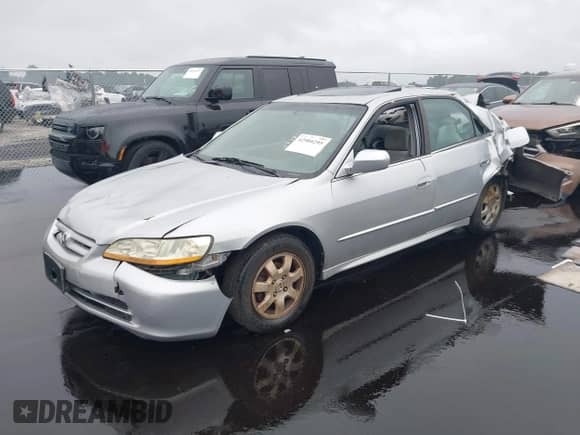 2002 Honda Accord SE z VIN 1HGCG66872A105867, wystawiony jako IAAI lot #42904295 z przebiegiem 167 277 mil mil oraz . Historia ofert i sprzedaży dostępna na DreamBid. Obrazek 18.
