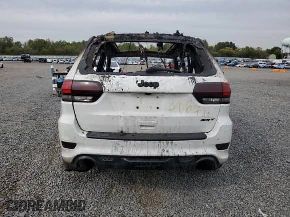 2014 Jeep Grand Cherokee SRT-8 с VIN 1C4RJFDJ0EC570886, выставлен на аукционе Copart как лот 83842595 с пробегом Не указан миль и Списание • Salvage title. История ставок и продаж доступна на DreamBid. Изображение 6.