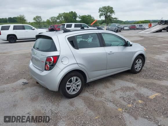 2012 Chevrolet Sonic LT with VIN 1G1JD6SBXC4214090, listed as a IAAI auction lot 42793504 with 152,185 mi miles and . Bid and sale history available at DreamBid. Image 4.