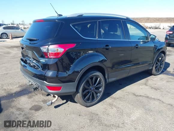 2017 Ford Escape Titanium with VIN 1FMCU0JD6HUE90933, listed as a IAAI auction lot 43035309 with 76,661 mi miles and . Bid and sale history available at DreamBid. Image 4.